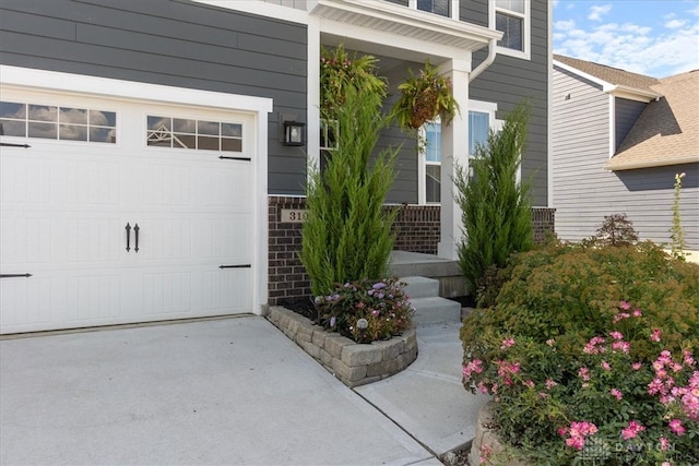 entrance to property featuring a garage