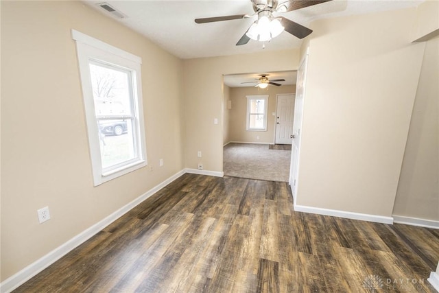 spare room with dark hardwood / wood-style flooring