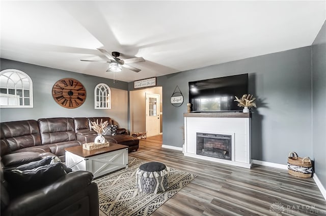 living room featuring hardwood / wood-style flooring and ceiling fan