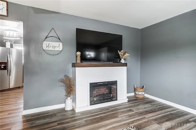 unfurnished living room with wood-type flooring