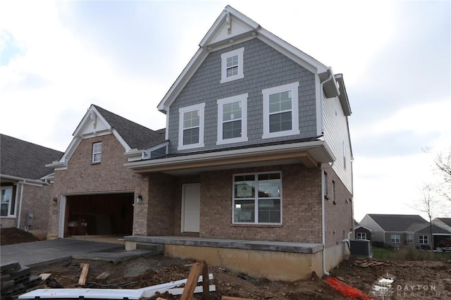 front of property featuring a porch and a garage