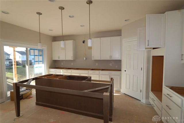 kitchen with white cabinets and pendant lighting