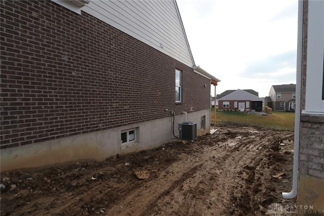 view of side of property featuring central AC unit