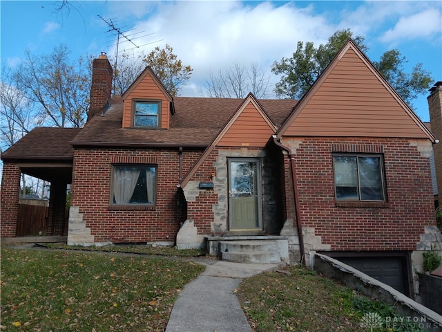 view of front of property featuring a garage and a front yard