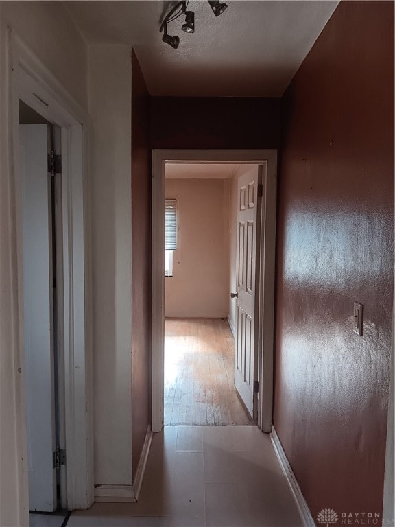 hallway with light hardwood / wood-style flooring