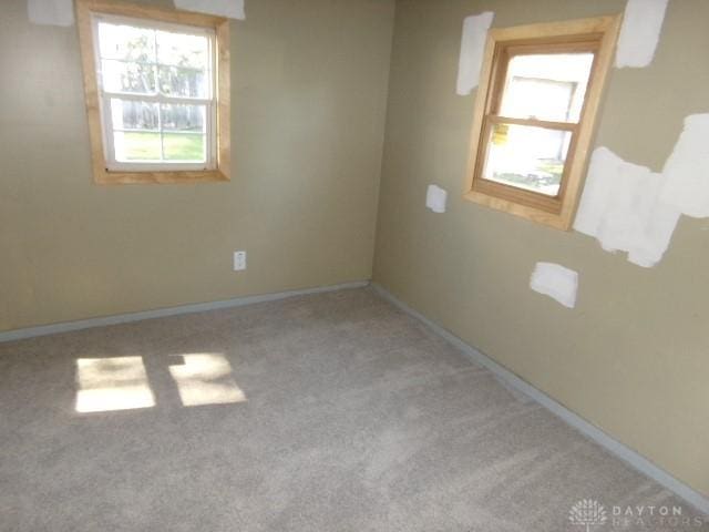 empty room with light colored carpet