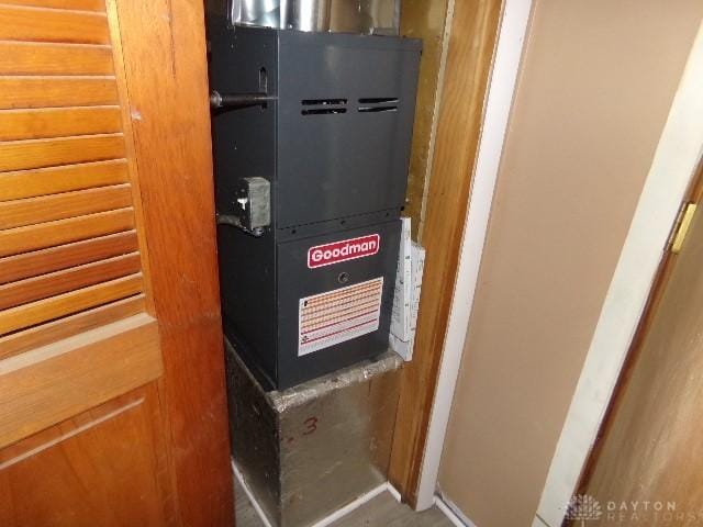 utility room featuring heating unit