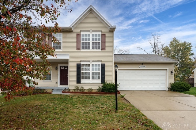 traditional home with an attached garage, driveway, and a front lawn