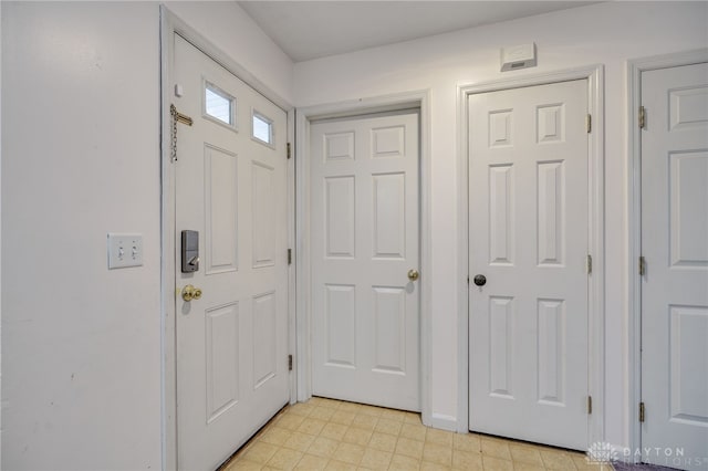 foyer featuring light floors