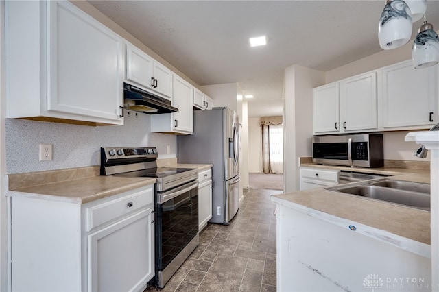 kitchen with stainless steel appliances, white cabinetry, a sink, and under cabinet range hood