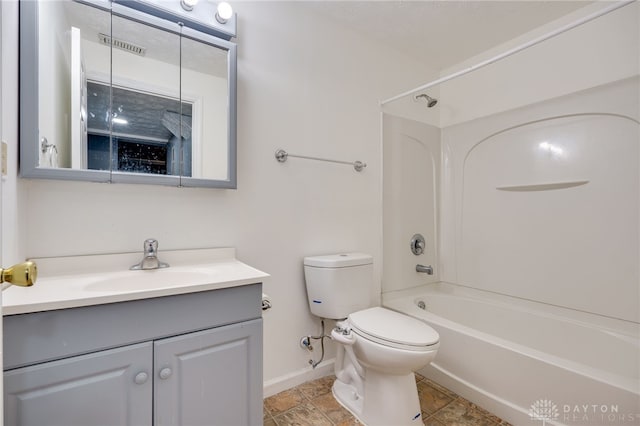 bathroom with toilet, bathing tub / shower combination, baseboards, and vanity