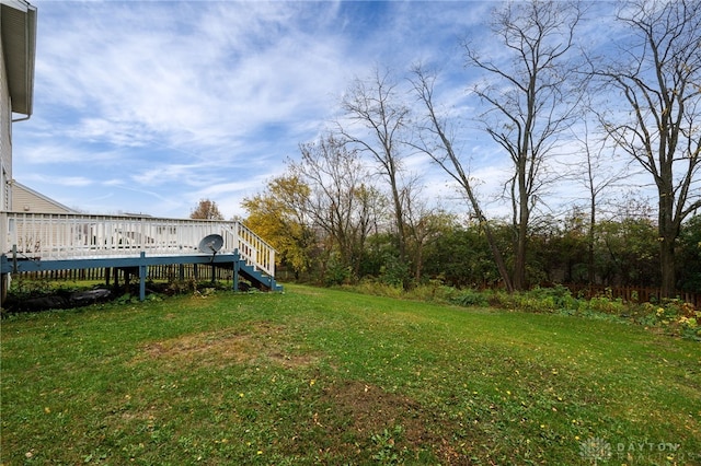 view of yard with a wooden deck