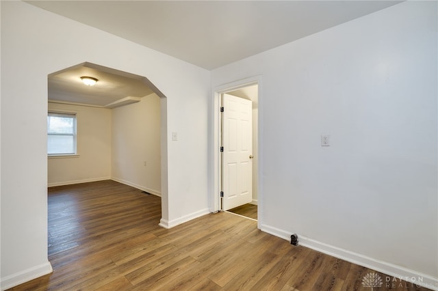 empty room with wood-type flooring