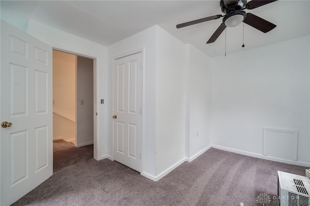 spare room with ceiling fan and carpet floors