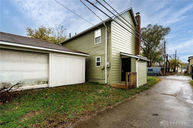 view of property exterior featuring a garage