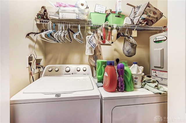 clothes washing area with separate washer and dryer