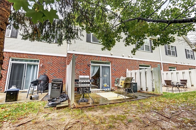 back of property with a patio