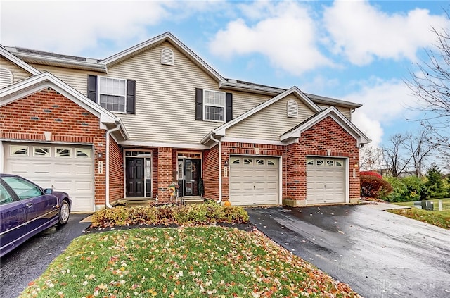 front of property with a garage