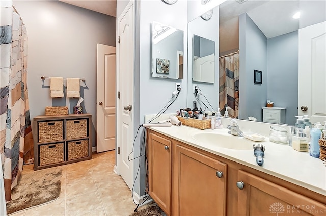 bathroom featuring tile patterned flooring and vanity