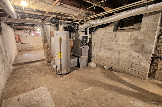 basement featuring water heater and heating unit