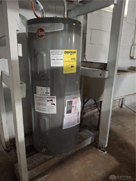 utility room featuring water heater