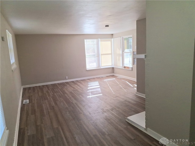 unfurnished room featuring dark hardwood / wood-style floors