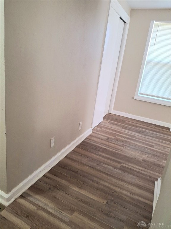 unfurnished room featuring dark hardwood / wood-style flooring