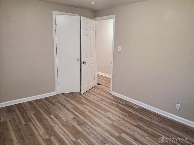 unfurnished bedroom featuring hardwood / wood-style floors