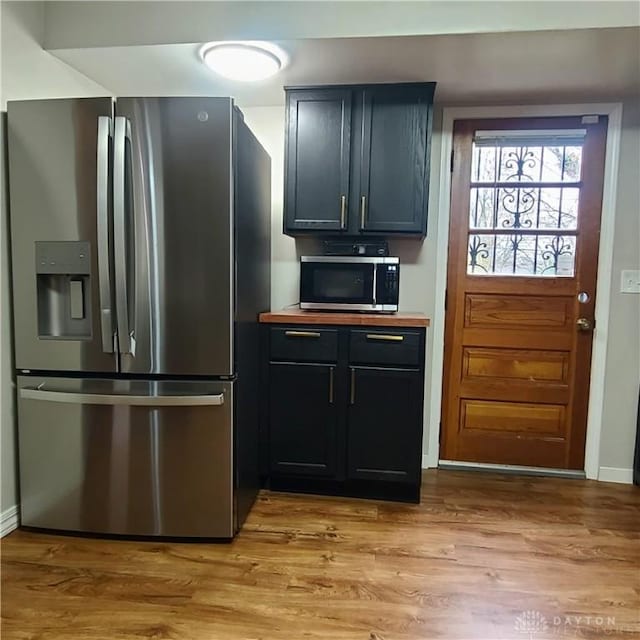 kitchen with light hardwood / wood-style flooring and stainless steel appliances