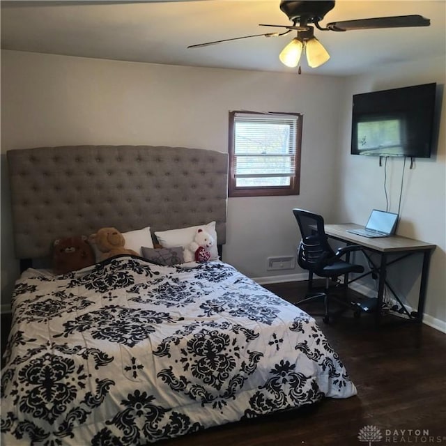 bedroom featuring dark wood-style floors, baseboards, and a ceiling fan