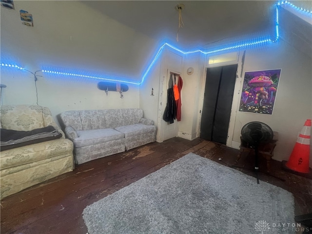 living room with dark wood-type flooring and vaulted ceiling