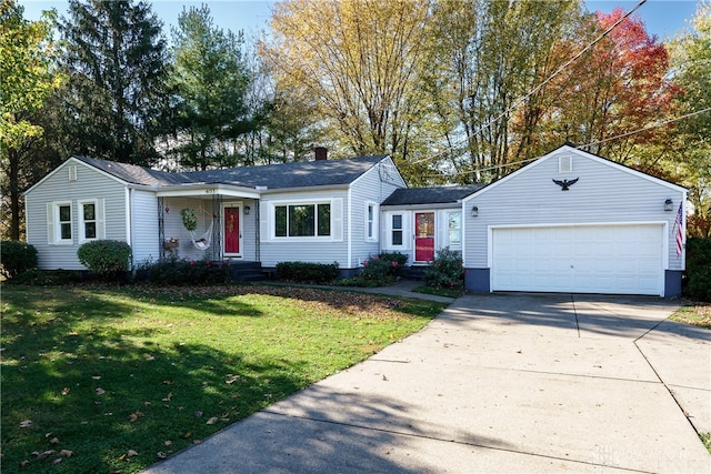 ranch-style house with a garage and a front lawn