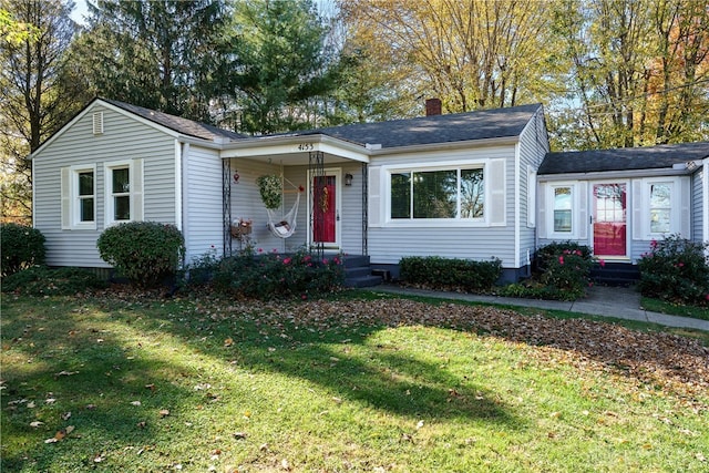 ranch-style house with a front lawn