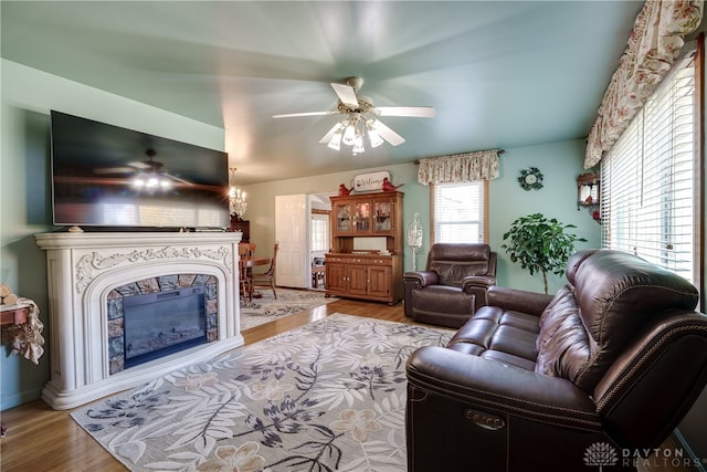 living room featuring hardwood / wood-style floors and ceiling fan