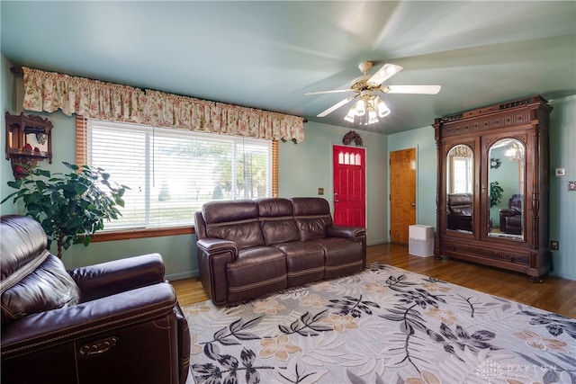 living room featuring ceiling fan and light wood-type flooring