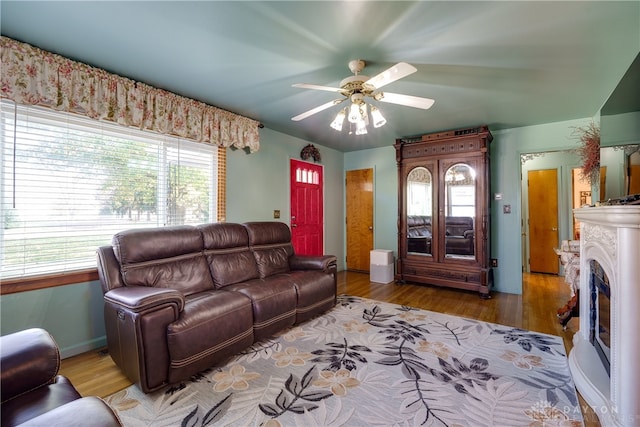 living room featuring ceiling fan and hardwood / wood-style flooring