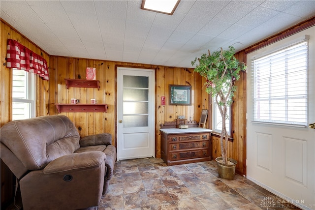 living room featuring wooden walls