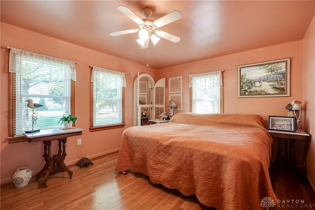 bedroom with hardwood / wood-style flooring and ceiling fan