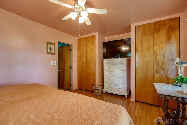 bedroom with ceiling fan and light wood-type flooring