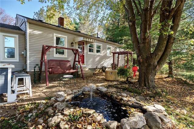 rear view of property with a patio area