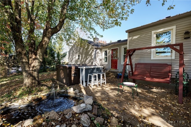 rear view of property featuring a patio