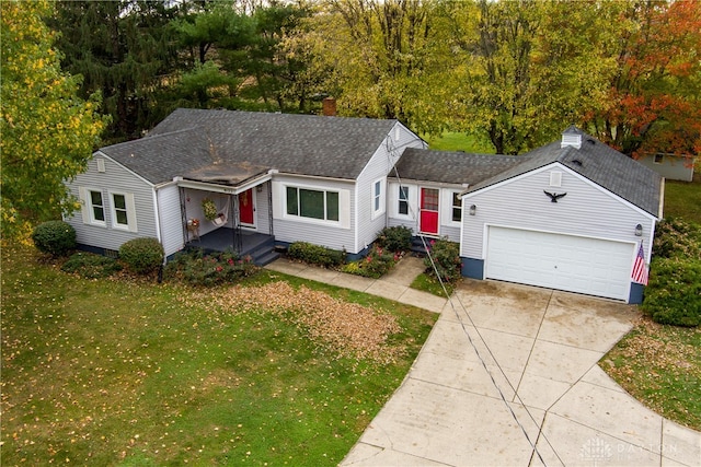 single story home featuring a garage and a front yard