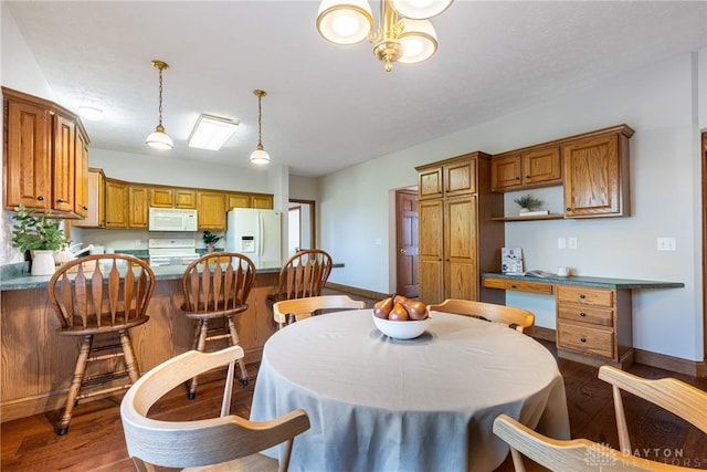 dining space with dark wood-type flooring