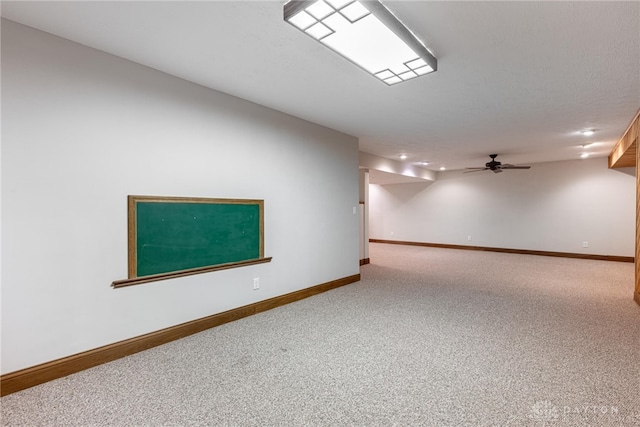 empty room with carpet flooring and ceiling fan