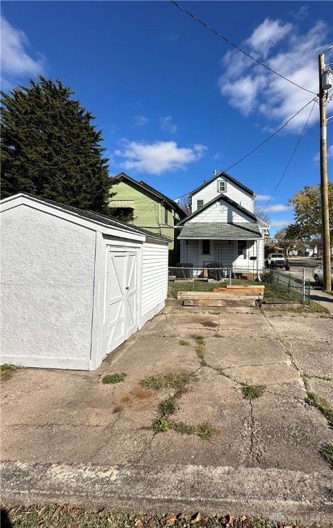 view of shed with fence