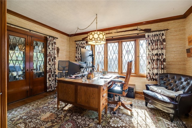 office featuring dark wood-type flooring, french doors, ornamental molding, and a textured ceiling