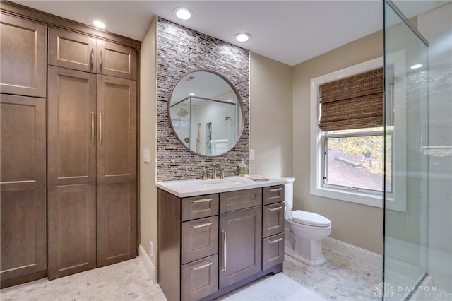 bathroom with an enclosed shower, vanity, tasteful backsplash, and toilet