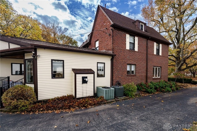 view of home's exterior with central AC