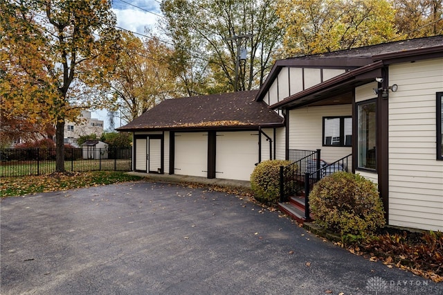 view of side of property featuring a garage