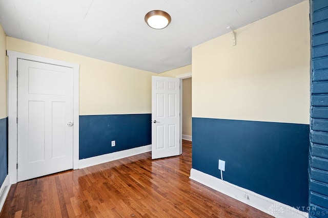 empty room featuring wood-type flooring